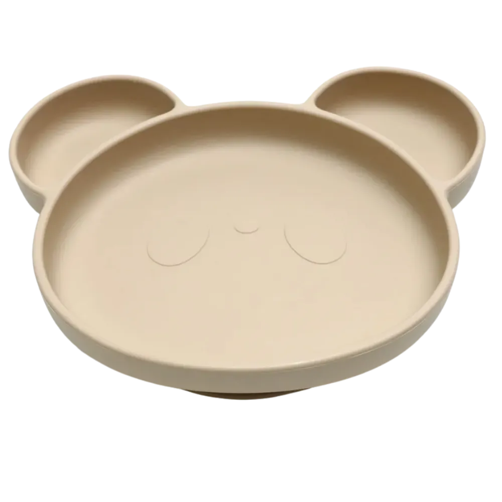 Assiette bebe ventouse beige sable au design minimaliste et épuré.