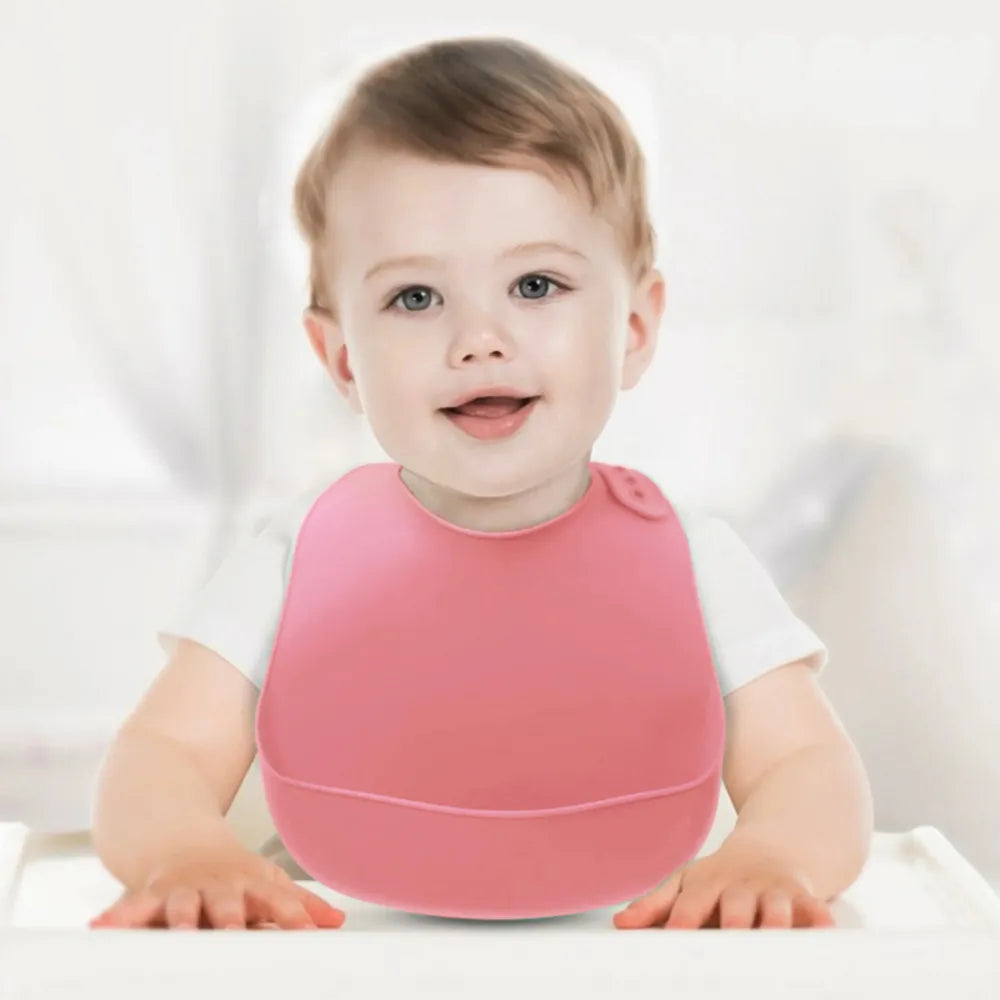 Bavoir Baby-Crea rose ajustable silicone